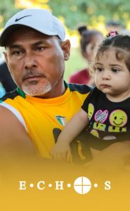 image of ricardo carrying a child
