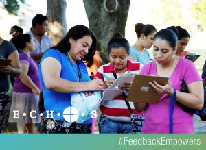 image of women willing out forms at ECHOS #feedbackempowers