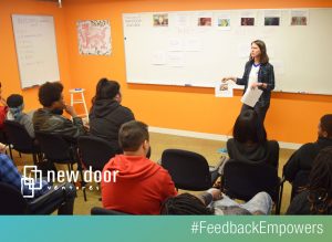image of a woman teaching a class at New Door Ventures #feedbackempowers