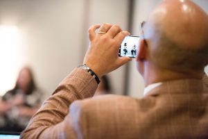 image of a man taking a photo at the 2018 Gathering