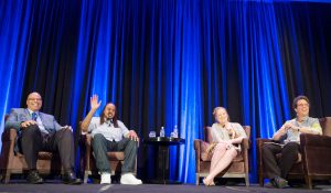 Image of Fay Twersky with others on stage at 2018 Gathering