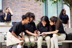 image of students talking to each other at DREAM charter school in New York city