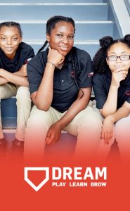 image of students sitting on the stairs at DREAM charter school in New York city