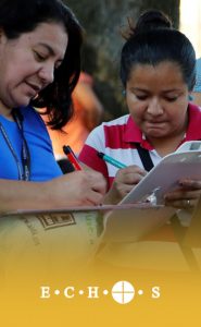 image of ladies filling out forms at ECHOS food pantry in Texas