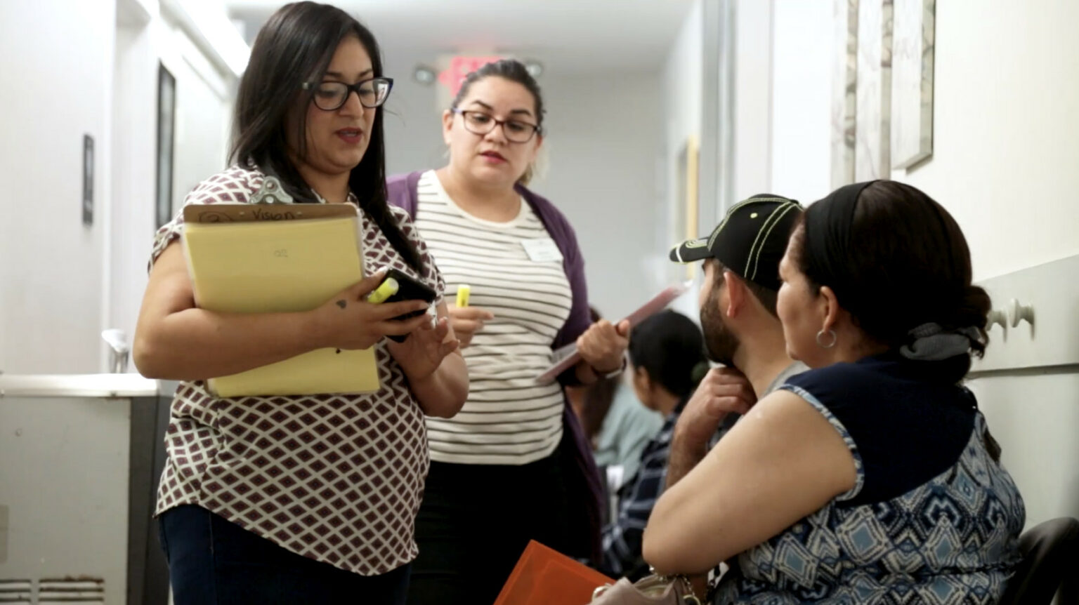 video still showing people at ECHOS staff talking to people in line for their services