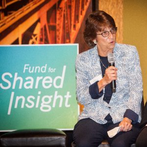 a lady presenting at Shared Insight meeting