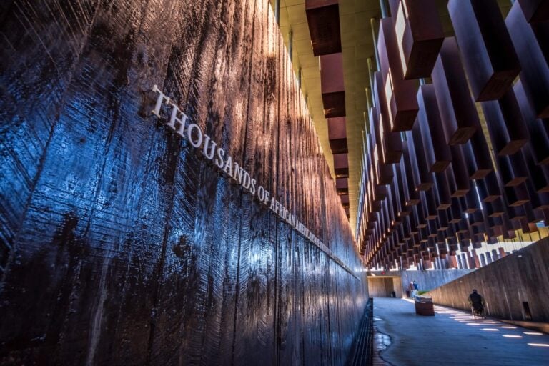 Water wall inscription at National Memorial for Peace and Justice memorializing more than 4,400 Black victims of racial terror lynchings between 1877 and 1950. Their names are engraved on more than 800 steel monuments—one for each county where a racial terror lynching took place